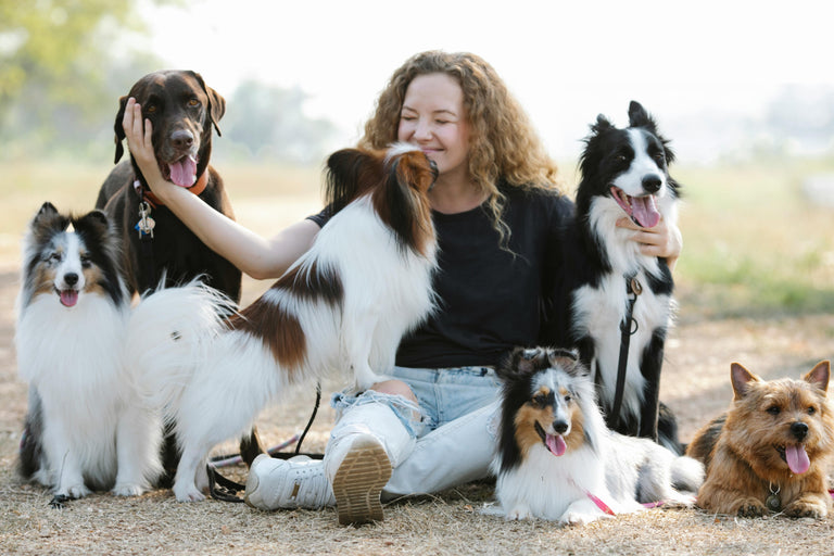 Woman holding her dogs
